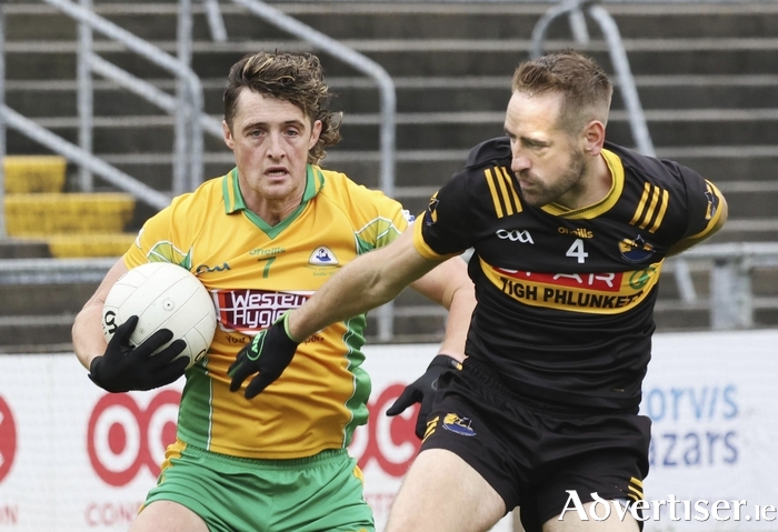 Kieran Molloy, Corofin and Eoin Mac Donnacha, Naomh Anna Leitir Móir in action from the Bon Secours Hospital Galway Senior Club Champion game at Pearse Stadium on Sunday. (Photo: Mike Shaughnessy)