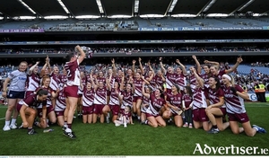 The Galway team, including Aoife Donohue, 12, celebrate with the O&#039;Duffy Cup after the Glen Dimplex All-Ireland Senior Camogie Championship final match between Cork and Galway at Croke Park in Dublin. (Photo by Ramsey Cardy/Sportsfile)