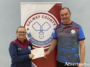 On behalf of Galway County Pickleball Club, Chairperson Caitriona Lawless presents sponsorship to Frank Kirrane in support of his participation at the European Pickleball Championships in Rome.