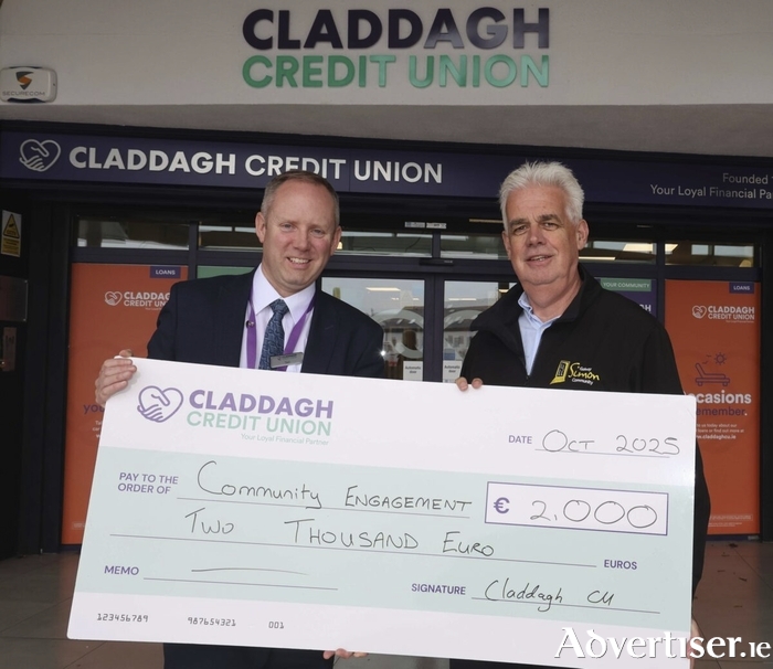Ted Coyle, Deputy CEO of Claddagh Credit Union presents Fintan Maher - Head of Fundraising & Communications Galway Simon of with a cheque for €2000 part of Claddagh Credit Union’s donation of €20,000 to seven charities and organizations in Galway. Photo: Mike Shaughnessy
