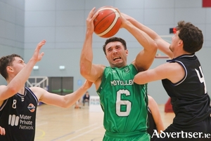 Maigh Cuilinn&rsquo;s Grant Olsson comes under pressure from Mather Private Malahide&rsquo;s Oisin Rice and Cian Daly in action from the Basketball Ireland Men&rsquo;s Division 1 game at University of Galway Kingfisher last season. (Photo: Mike Shaughnessy) 