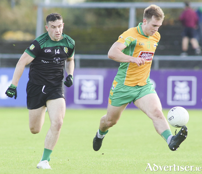 Dunmore McHales’s Padraig Costello chases Corofin’s Darragh Silke in action from the Bons Secours Hospital Senior Football Championship game at Tuam Stadium. (Photo: Mike Shaughnessy)