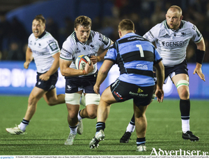 Cian Prendergast of Connacht Rugby takes on Danny Southworth of Cardiff Rugby during the United Rugby Championship match between Cardiff Rugby and Connacht at Cardiff Arms Park in Wales. 
(Photo by Gareth Everett/Sportsfile)