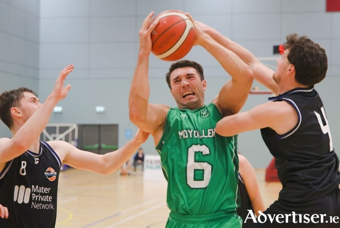 Maigh Cuilinn’s Grant Olsson comes under pressure from Mather Private Malahide’s Oisin Rice and Cian Daly in action from the Basketball Ireland Men’s Division 1 game at University of Galway Kingfisher last season. (Photo: Mike Shaughnessy)