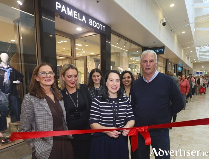 Katia Santos, manager of Pamela Scott Galway Shopping Centre along with staff Sarah O’Mahony, Orla Griffin, Lucia Ruiz, Rachel Murray and John Barron cuts the ribbon at the opening of the new Pamela Scott store in Galway Shopping Centre on Thursday. Photo: Mike Shaughnessy