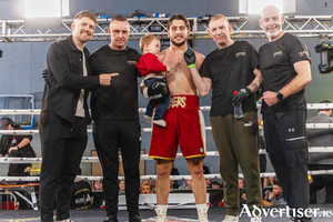 Jason Myers, pictured with his team after his first-round TKO victory.