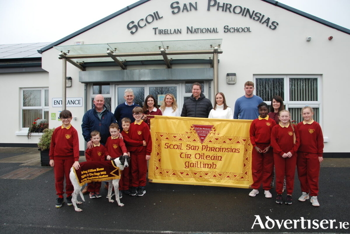 Pupils and staff and committee members at the launch of the Night At The Dogs for Cillian to be held next week.


