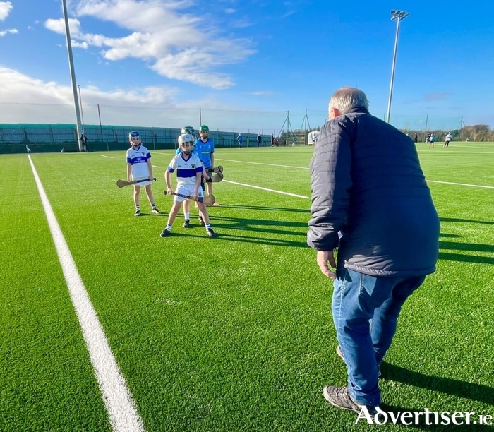 Chairperson, Sean Greene, throwing in the sliotar at the first ever game on Oranmore Maree GAA’s new 4G Astro Pitch in a match between the club’s U11 hurlers and St Vincents from Dublin.