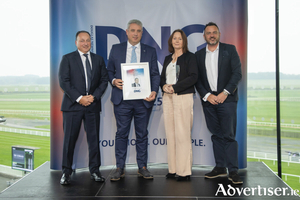 Keith Lowe DNG Chief Executive, Martin and Cora O&#039;Connor and Dan Willis, celebrating their 20th year in business.