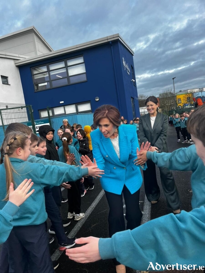 Minister Hildegarde Naughton greeting the pupils of Scoil Íosa during her visit. 