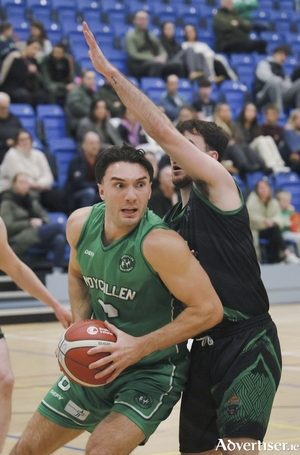 Mhaigh Cuilinn&rsquo;s Grant Olsson under pressure from Michael Wallace of Portlaoise Panthers in action from the Basketball Ireland Domino&rsquo;s Division 1 National League game at the Kingfisher Sports Centre last Saturday evening. (Photo: Mike Shaughnessy)