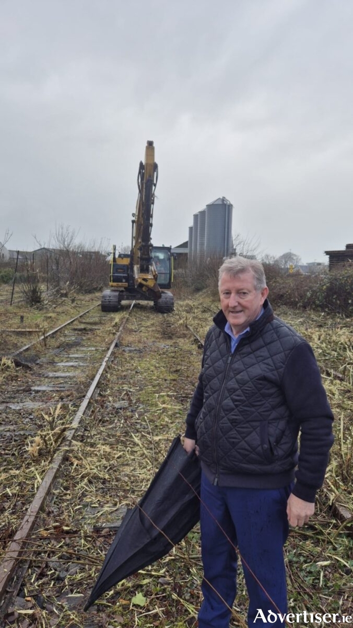 Minister Sean Canney at the site of rail clearing works near Tuam.