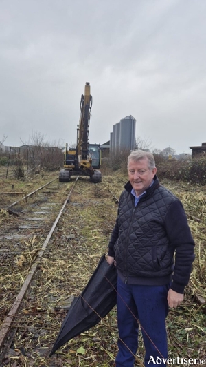 Minister Sean Canney at the site of rail clearing works near Tuam.