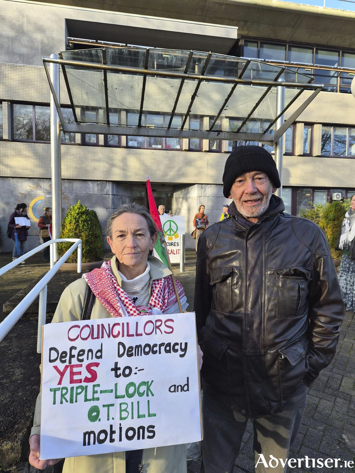 Dette McLoughlin, of Knocknacarra Palestine Network, and Damien Flinter, of the Progressive Hypocrite Party, campaigning outside City Hall earlier this month.