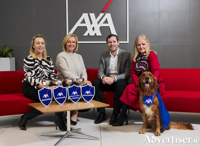 From left: AXA Ireland head of marketing Elaine Kearney, head of external communications & customer engagement Aideen McGrath, regional manager, direct retail Ciaran Goodman, and chief communications, brand & sustainability officer Elizabeth Arnett, with Setanta the golden retriever who was on duty as AXA Ireland&rsquo;s office for the launch of the AXA Community Hero Awards. 