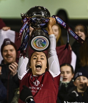 Athenry captain Dervla Higgins lifts the Bill and Agnes Carroll Cup after her side's victory in the AIB All-Ireland Camogie Senior Club Championship final replay match between Athenry of Galway and St Finbarr's of Cork at FBD Semple Stadium in Thurles, Tipperary. (Photo by Ben McShane/Sportsfile)