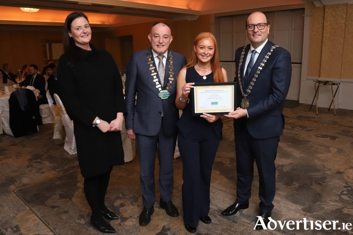 Deirdre Fitzsimons, director of people, Irish Hotels Federation (IHF), Padraig Nolan, Chairperson Galway Branch IHF, General Manager, Oranmore Lodge Hotel, and IHF President Michael Magner present Chantelle Moran, F&B Assistant, Maldron Hotel Sandy Road, with her award at the Irish Hotels Federation Galway Branch Employee Of The Year Awards 2025/26 at the Ardilaun House Hotel, Galway. Photo: Brian Harding.