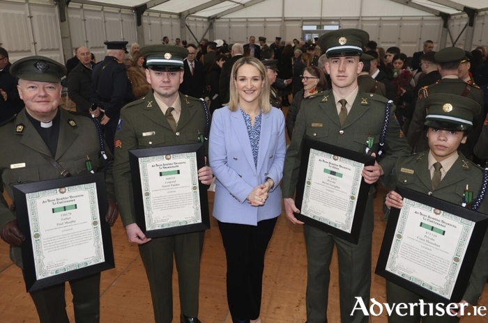 Minister for Defence Helen McEntee with (l-r) Fr Paul Murphy with his Distinguished Service Medal (DSM) with Merit, Cpl Daniel Padden, DSM with Distinction, Pte Dylan Geraghty, DSM, with Honour, and Pte Ciara Shanahan, DSM with Merit. (Photo: Mike Shaughnessy)