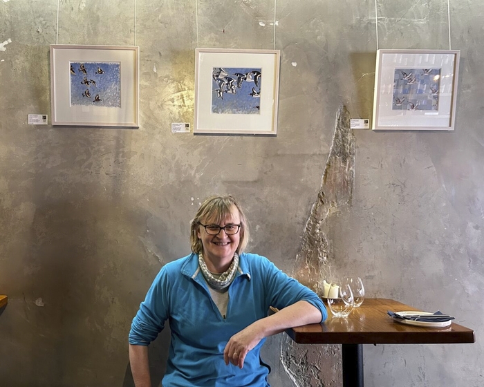 Artist Sacha Hutchinson pictured with her art in Dar&oacute;g winebar on Dominick Street