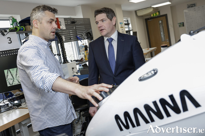 Paul Connolly (L), head of hardware engineering, Manna Air Delivery, gives a guided tour through the manufacturing workshop to Peter Burke, Minister for Enterprise, Tourism and Employment, at the Dublin HQ of Manna Air Delivery where the the company announced their ambition to create 400 jobs in Ireland and the USA. Wednesday 1st April. PIC: Julien Behal
