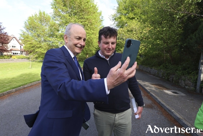 Miche&aacute;l Martin canvassing with Cllr Cillian Keane ( FF) in Moycullen on Tuesday evening. Photo: Mike Shaughnessy