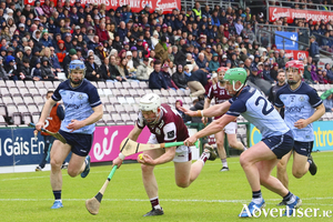 John Fleming comes under pressure from Dublin&rsquo;s Conor McHugh in action during the Leinster GAA Hurling Senior Championship game at Pearse Stadium. (Photo: Mike Shaughnessy)