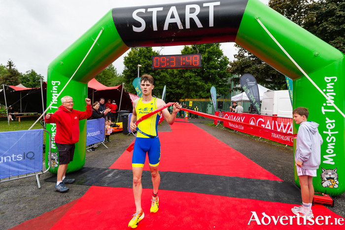 2025 Tribesman Triathlon Winner Mathys Bocquet crossing the finish line. (Credit James Wright)