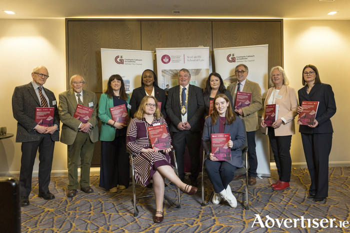 Standing left to right: Michael Hanna, Secretary and Salters Sterling, former Chairperson, Birr Travellers and Settled Peoples Group; Sharon Carroll, Senior Executive Officer, Housing and Integration Services, Galway City Council; Councillor Helen Ogbu; Councillor John McDonagh; Elizabeth Fanning, A/Director of Services, Housing and Integration, Galway City Council; Professor Padraic Kenna, University of Galway, Lead Author of the Report, Cecilia Forrestal, Community Facilitator and co-author of the report; Edel Killarney, Traveller Accommodation Officer, Galway City Council.
Seated left to right: Eithne Murphy, Senior Engineer, and Catherine Fahy, Senior Social Worker, Housing and Integration, Galway City Council
Photo: Anita Murphy

