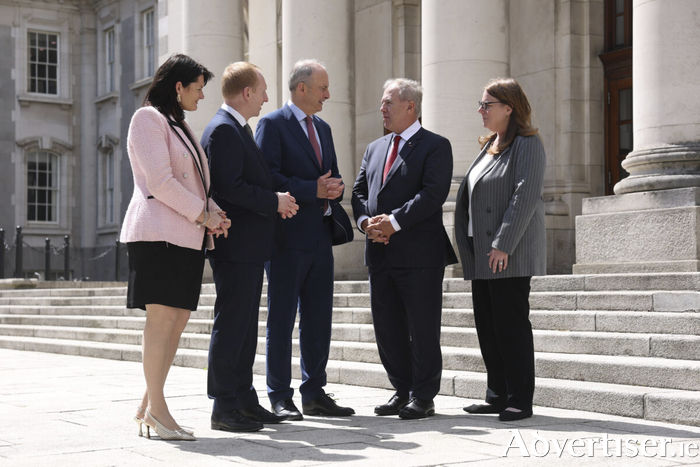 Taoiseach Miche&aacute;l Martin and Michael Lohan, CEO of IDA Ireland join OpenText to announce creation of 400 new jobs in Cork and Galway as part of &euro;105m investment in expanding Agentic AI, Sovereign Cloud and Cybersecurity in Europe. Pictured L to R: Anne Marie Tierney Le Roux, Head of Technology at IDA Ireland; Michael Lohan CEO of IDA Ireland; Taoiseach Miche&aacute;l Martin TD: Tom Jenkins, Chairman of OpenText and Shannon Bell, Chief Digital Officer & Chief Information Officer at OpenText.