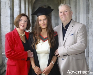 Dr Alison McHugh of Beech Court who graduated from the school of Medicine at University of Galway on Thursday pictured with her parents Mary and Ciaran. Alison featured on the front page of The Galway Advertiser when she started school at Scoil Iogn&aacute;id in August 2006. Both photos by Mike Shaughnessy