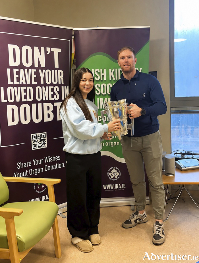 Michelle Barry with her former teacher, Tipperary hurler Jason Forde at the dialysis unit in Limerick Hospital.
