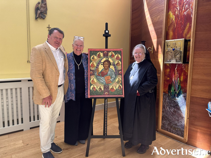 Martin Dunphy and artist Susan Kelly von Medicus presenting Mother Karol O&rsquo;Connell OSB with the icon