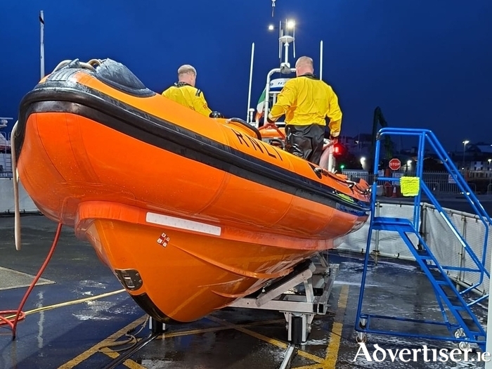 Galway RNLI crew Paddy Hennelly and Mark Purcell washing down the lifeboat in the early hours of Monday morning. The crew of James Rattigan, Paddy Hennelly, Mark Purcell and helm Declan Killilea responded to three different call outs during the night, after their pagers went off at 1am.