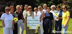 Sunflower Days volunteers pictured supporting Galway Hospice during this year's fundraising campaign. Front row: Christine Finnerty and Clodagh Hennessy. Back row (L-R): Trudy Concannon, Anne McEntee, Bernie Kilmartin, Mary Lynch, Teresa Roche, Ann Carty, Kathrina Kenny, Mary Burke, Jim Hynes, Susan Royston and Agatha McCormack.