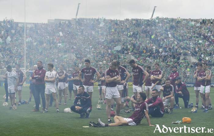 August 19, 2018: The dejected Galway team are seen through the smoke from fireworks after the GAA Hurling All-Ireland Senior Championship Final match between Galway and Limerick at Croke Park in Dublin. Photo by Brendan Moran/Sportsfile

