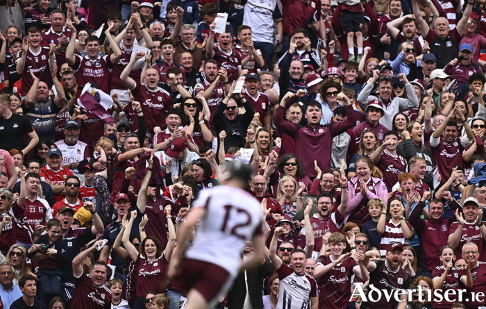 Galway supporters celebrate their side's first goal, scored by Darragh Neary, during the GAA Hurling All-Ireland Senior Championship semi-final at Croke Park. (Photo by Seb Daly/Sportsfile)