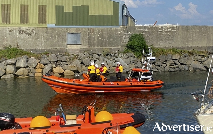 The Lifeboat crew returning to port after the callout.