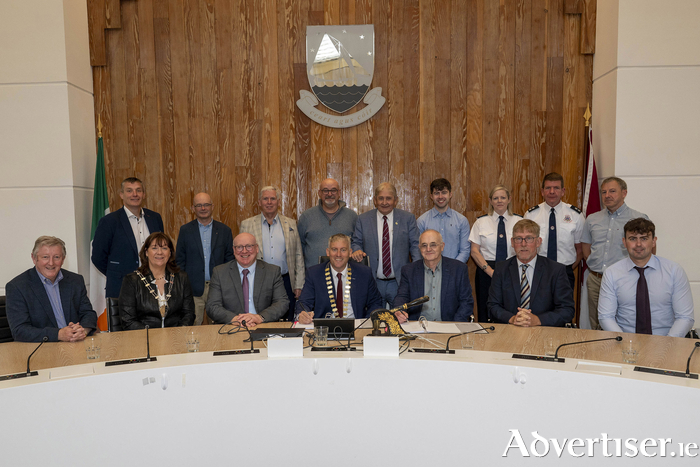 Pictured at the contract signing for the construction of a new fire station in Loughrea, left to right, Minister of State Se&aacute;n Canney, TD; Cathaoirleach of Loughrea MD, Cllr Geraldine Donohue; Liam Conneally, Chief Executive, Galway County Council; Cathaoirleach Cllr. Andrew Reddington; Michael Burns, Burns Construction & Civil Engineering Ltd.; Director of Services Uinsinn Finn; Brian Cassidy, Quantity Surveyor. Back left to right, Cllr Ivan Canning; Brian Fahy, Senior Architect; Cllr Michael Regan; Cllr Declan Kelly; Cllr Moegie Maher; Gary Keane, QS Burns Construction; Michelle Hennelly, Senior Assistant Chief Fire Officer; Michael Ward, Loughrea Fire Station Officer; Maurice Headd, Galway Fire. Photo credit: Murtography.