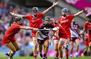 Aoife Donohue of Galway is swarmed by Cork players, Laura Treacy, Ashling Thompson, Aoife Healy and Sorcha McCartan during the Glen Dimplex All-Ireland Senior Camogie Championship final. (Photo by Ramsey Cardy/Sportsfile)