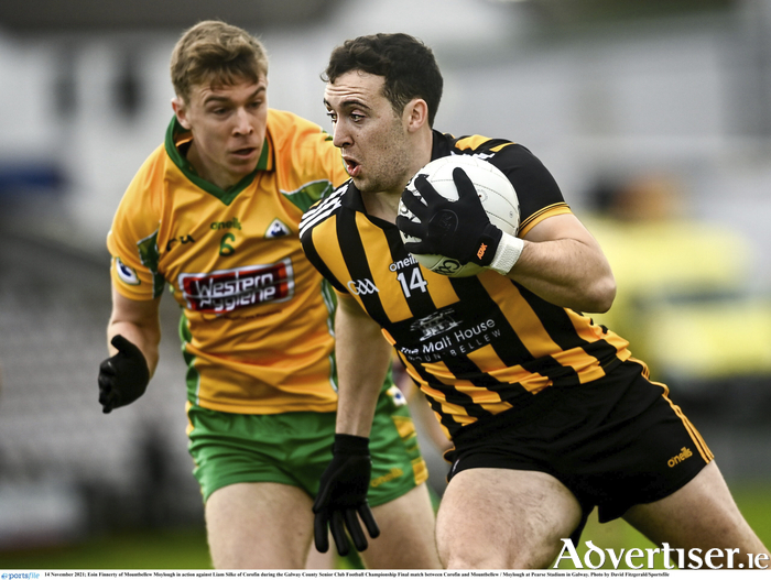 Eoin Finnerty of Mountbellew Moylough against Liam Silke of Corofin during the 2021 Galway County Senior Club Football Championship Final. (Photo by David Fitzgerald/Sportsfile)