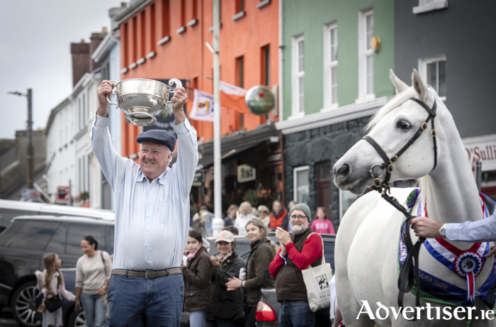 Pat Mullen celebrating with the cup during the Parade oOf Champions around Clifden on Friday evening after winning the Supreme Championship on Wednesday with Gurteen Jennifer