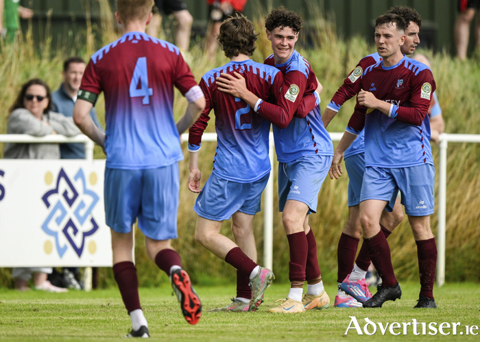 Donnacha McNamara celebrates with teammates after netting the equaliser against Lucan United. (Photo by Eakin Howard/Sportsfile)