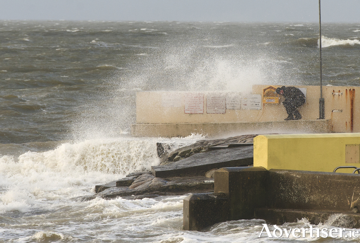Man caught by waves at Salthill Galway at high tide.
 Photo: Andrew Downes.