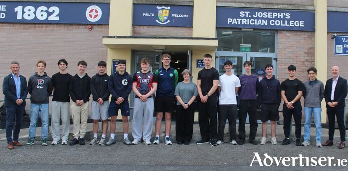 11 of the high achieving students from the Leaving Cert class of 2026, along with Principal Sarah Gleeson, Deputy Principals, Mr Robert Grealish and Mr Barry McDermott.