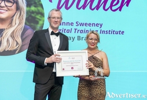 Joanne Sweeney, Digital Training Institute, won the Established Businesswoman of the Year Award at the Network Ireland Businesswoman of the Year Awards in Galway. Presenting her award is Adrian Moynihan AIB. Photograph: Patrick Browne