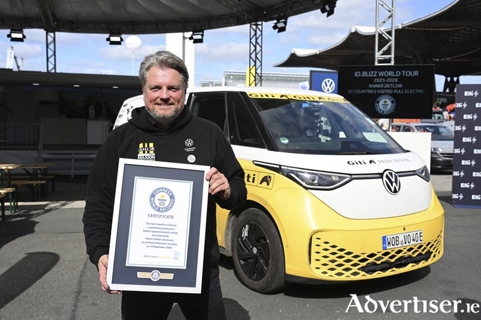 Rainer Zietlow pictured with his Guinness World Record and Volkswagen ID. Buzz.