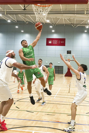 Maigh Cuilinn captain Grant Olsson scores against Tip Talons in the Basketball Ireland Domino&rsquo;s Men&rsquo;s Division One game at Kingfisher Sports Centre. (Photo: Mike Shaughnessy)