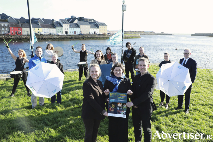 Sponsors and supporters of Tonnta 2027 gather for a photo at the launch of the festival&rsquo;s headliners, with some of the artists set to feature in the 2027 programme pictured in the background. Front row (L&ndash;R): Sally-Ann O&rsquo;Brien and Richie McCarthy, Galway City Council, with Br&iacute;d N&iacute; Chongh&oacute;ile, Gaillimh le Gaeilge, organisers of Tonnta 2027. Back row (L&ndash;R): M&aacute;irt&iacute;n &Oacute;g Lally, Lally Tours; Majella N&iacute; Chr&iacute;och&aacute;in, IMRAM; Clodagh Carey and Janice Lyons, Carey Building Construction; David Hayes, Ask Acorn; and Lisa Stewart and Ted Coyle, Claddagh Credit Union.